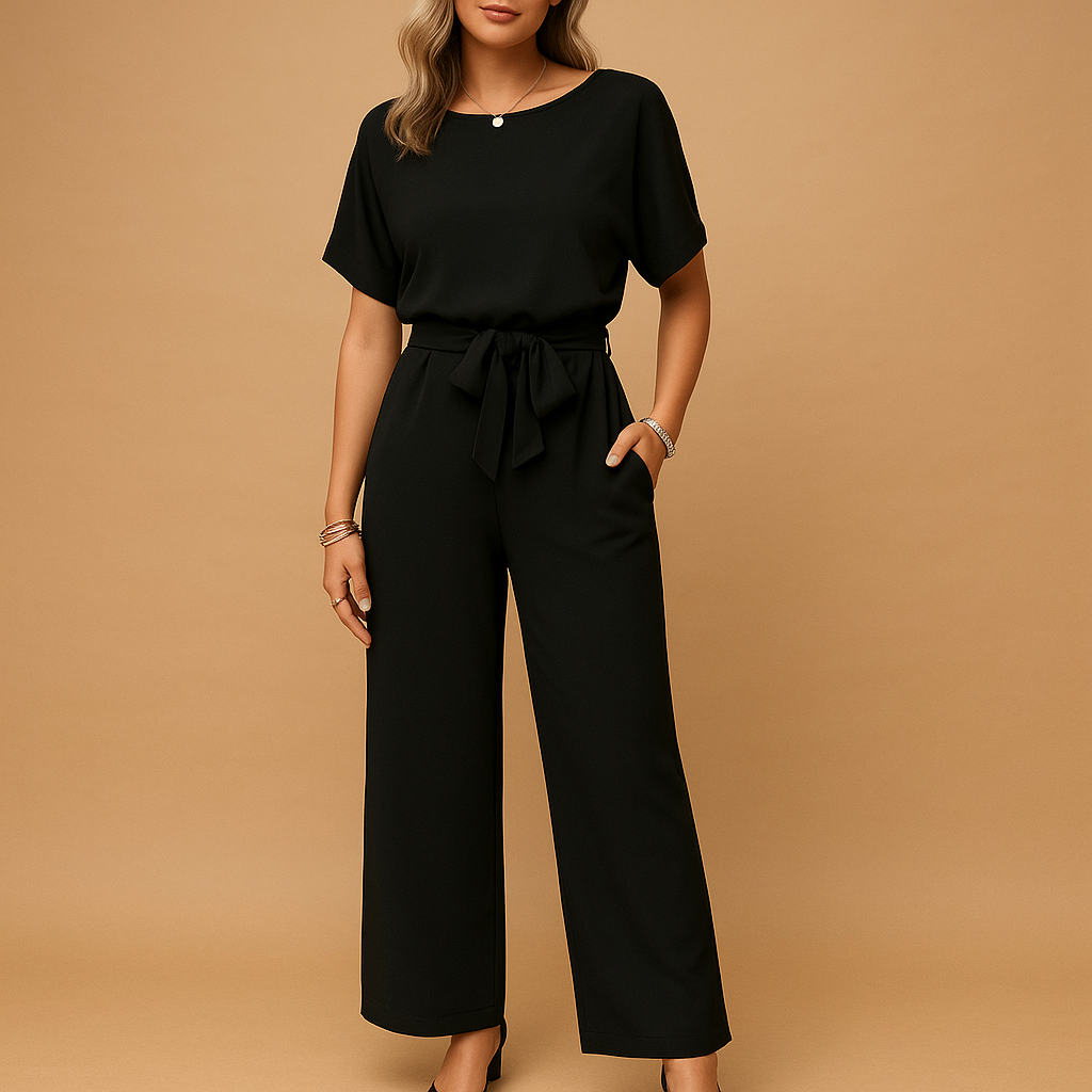 Woman wearing an elegant formal jumpsuit with a tailored fit and flowing sleeves, suitable for galas, weddings, and stylish evening occasions.